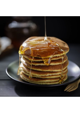 Golden maple syrup on pancake
