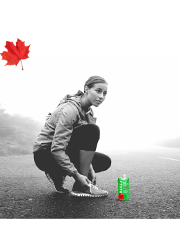 athlete with a bottle of Maple 3 maple water in full effort in Quebec
